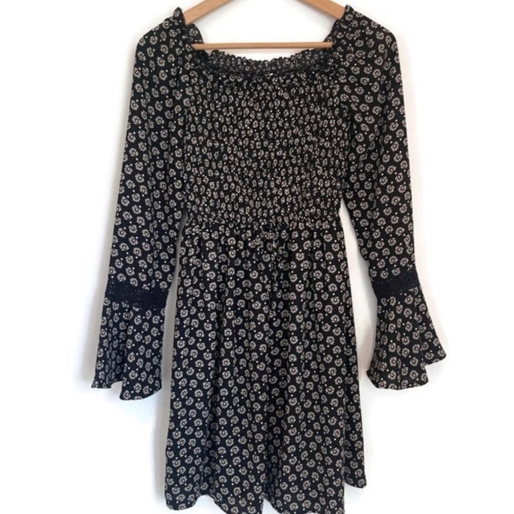 Black and cream long sleeve floral print dress with pockets.